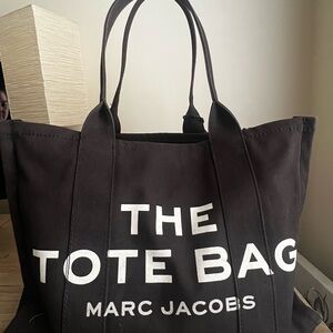 Pre owned Marc Jacobs Black Canvas Tote, a few marks inside, handles and .